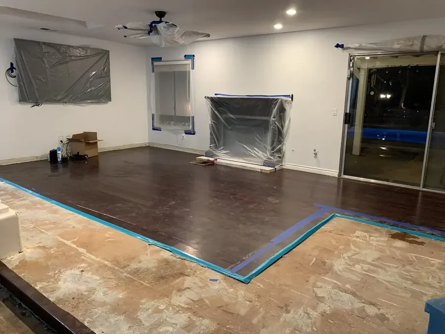 Plastic sheeting and taped floor protection inside a drying work area