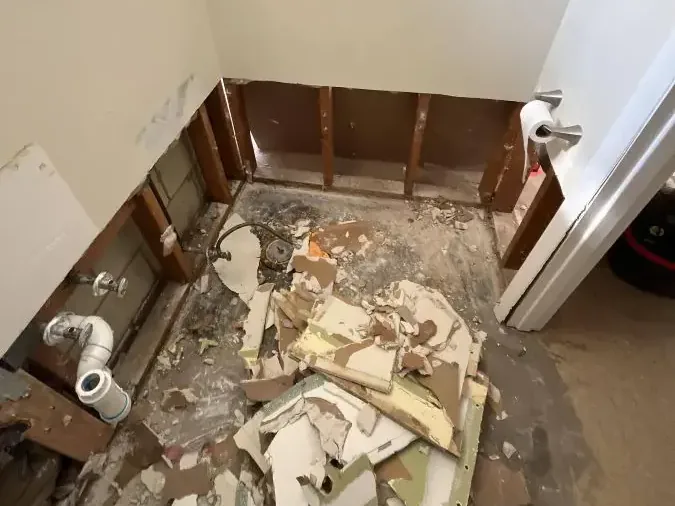 Bathroom opened to wall framing during contaminated-water cleanup