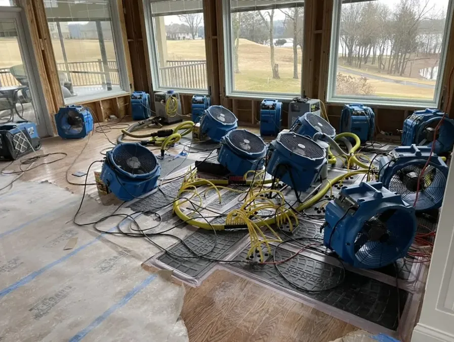 Water-damage drying equipment arranged inside a home after a leak