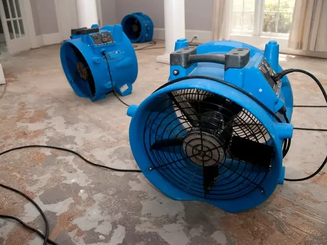 Air movers and dehumidification equipment arranged to dry a room